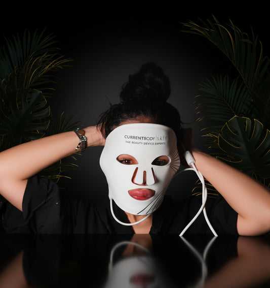 Person wearing a white face mask with cat design