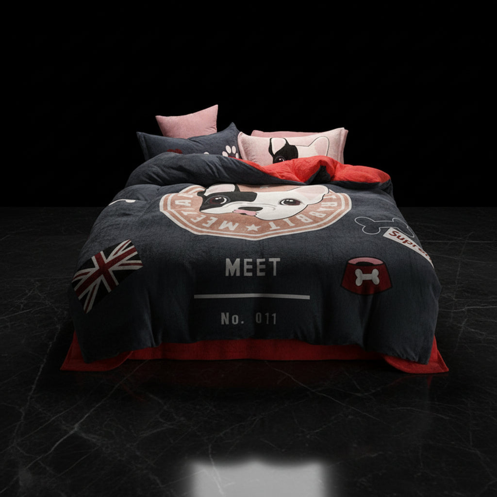 A four-piece bed sheet set with a cartoon theme, featuring a blue color with white polka dots and text, displayed on a bed with pillows and a quilt.