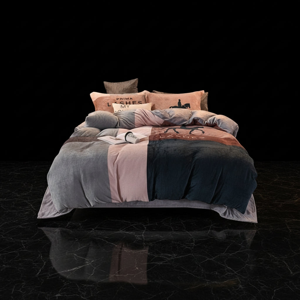 A four-piece bed sheet set with a cartoon theme, featuring a blue color with white polka dots and text, displayed on a bed with pillows and a quilt.