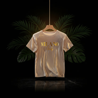 A sparkling champagne golden graphic t-shirt with 'MILANO Italy' printed on the front, displayed on a beige background.