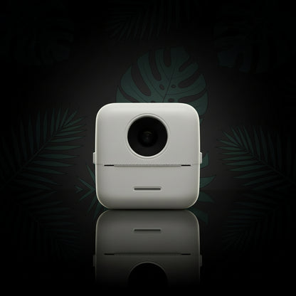 A portable mini thermal printer on a marble surface.