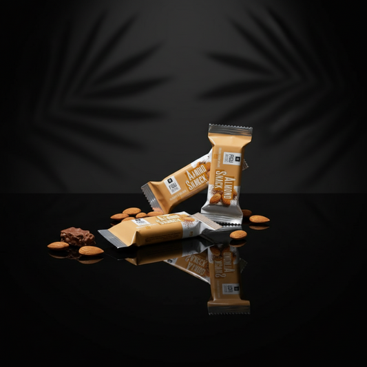 Almond snack bars and a bowl of almonds on a wooden board with a white background.