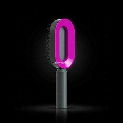 A wide tooth hair detangler brush with a black handle and brown head.