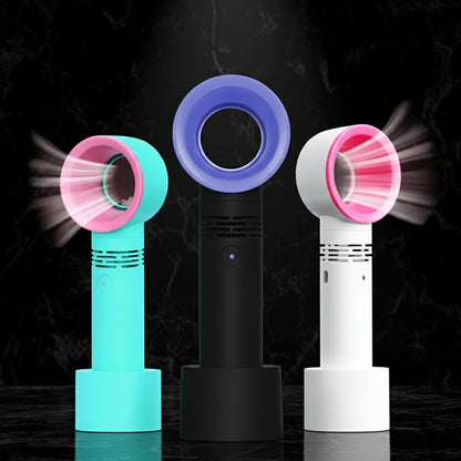 Three rechargeable eyelash blowers in different colors (blue, black, and pink) standing upright.