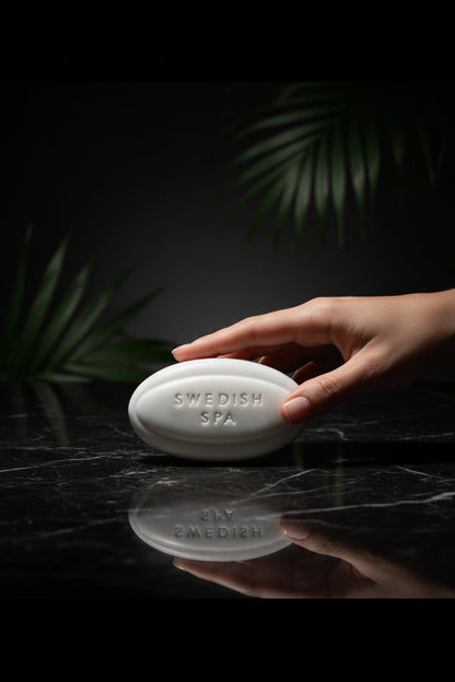 Bar of soap labeled 'Swedish Spa' on a textured surface