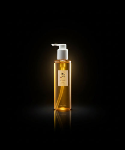 Person holding a bottle of yellow liquid soap in front of a window.