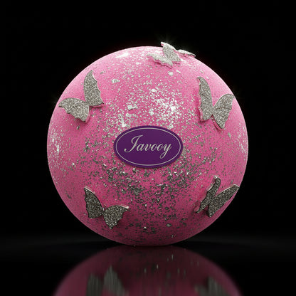 Pink bath bomb with silver butterflies and a purple label on a black background