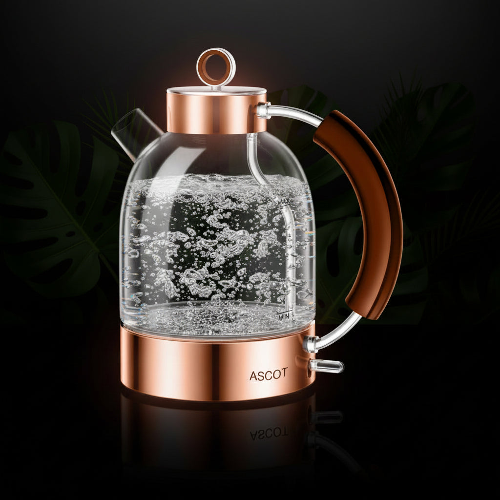 Clear glass teapot with copper accents and a brown handle on a white background